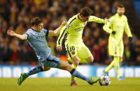 Football - Manchester City v FC Barcelona - UEFA Champions League Second Round First Leg - Etihad Stadium, Manchester, England - 24/2/15 Manchester City's James Milner in action with Barcelona's Lionel Messi Reuters / Darren Staples Livepic EDITORIAL USE ONLY.