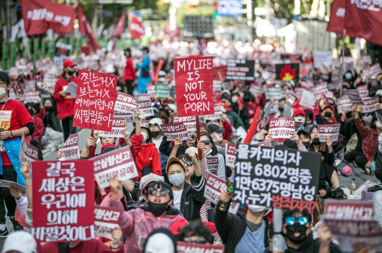 South Korean women protest against sexism and digital sex crimes, such as the making of pornography using hidden cameras. <a href="https://www.gettyimages.com/detail/news-photo/south-korean-women-protest-against-sexism-and-hidden-camera-news-photo/1046462564" rel="nofollow noopener" target="_blank" data-ylk="slk:Jean Chung/Getty Images;elm:context_link;itc:0;sec:content-canvas" class="link ">Jean Chung/Getty Images</a>