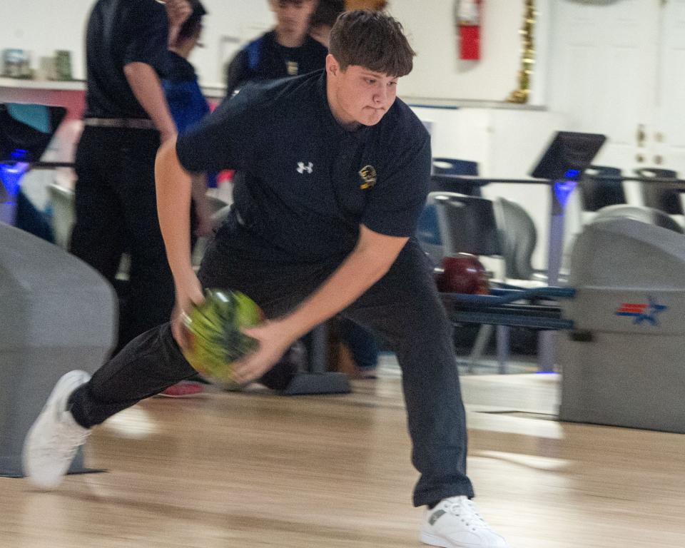 Red Lion’s Dalton Ludwig uses two hands to roll the ball in a match against Kennard-Dale on Wednesday, Dec. 13, 2022.