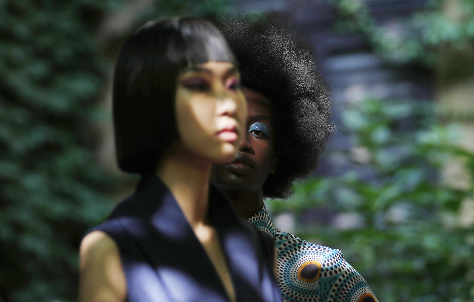 Models wear creations part of the Joy 2021 women's spring-summer collection at the "We are Made in Italy - Black Lives Matter in Italian fashion Collection" event during the Milan's fashion week in Milan, Italy, Thursday, Sept. 17, 2020. (AP Photo/Antonio Calanni)