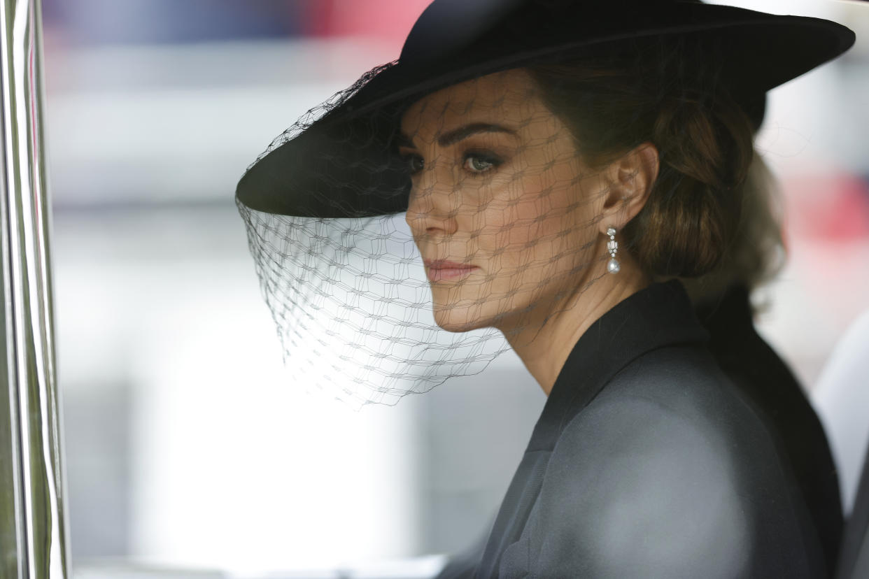 LONDON, ENGLAND - SEPTEMBER 19: Kate Middleton, Princess of Wales is driven down The Mall after the funeral for HM Queen Elizabeth II's funeral on September 19, 2022 in London, England. Elizabeth Alexandra Mary Windsor was born in Bruton Street, Mayfair, London on 21 April 1926. She married Prince Philip in 1947 and ascended the throne of the United Kingdom and Commonwealth on 6 February 1952 after the death of her Father, King George VI. Queen Elizabeth II died at Balmoral Castle in Scotland on September 8, 2022, and is succeeded by her eldest son, King Charles III.  (Photo by Tom Jenkins - WPA Pool/Getty Images)