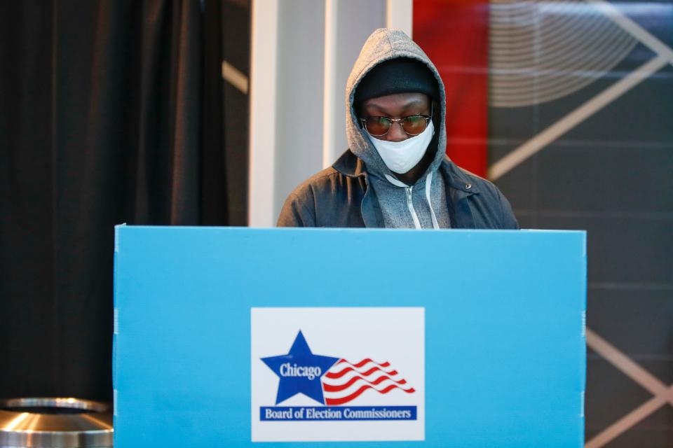 A man casts his ballot at a polling place.