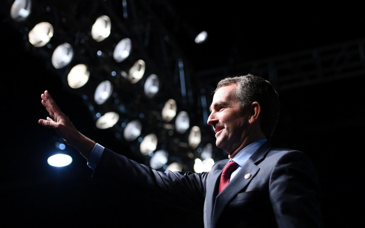 This file photo taken on October 19, 2017 shows Virginia Lieutenant Governor Ralph Northam, the state's Democratic gubernatorial candidate, waving as he arrives to speak during a campaign rally in Richmond, Virginia - AFP