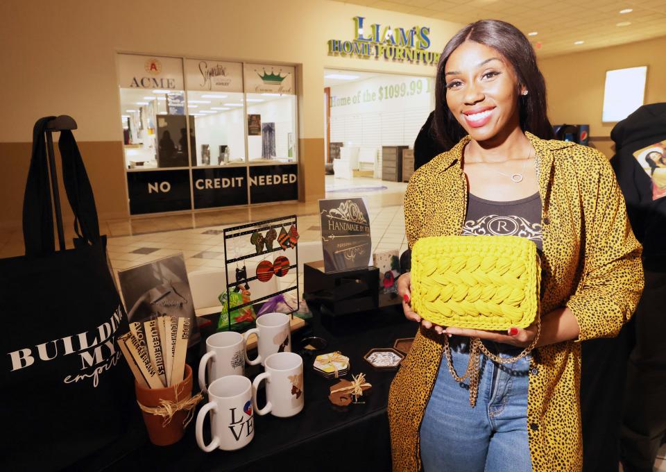 Rita DePina, owner of Handmade by Rita, is a vendor at a women-owned pop-up market at the Westgate Mall on Saturday, March 25, 2023.