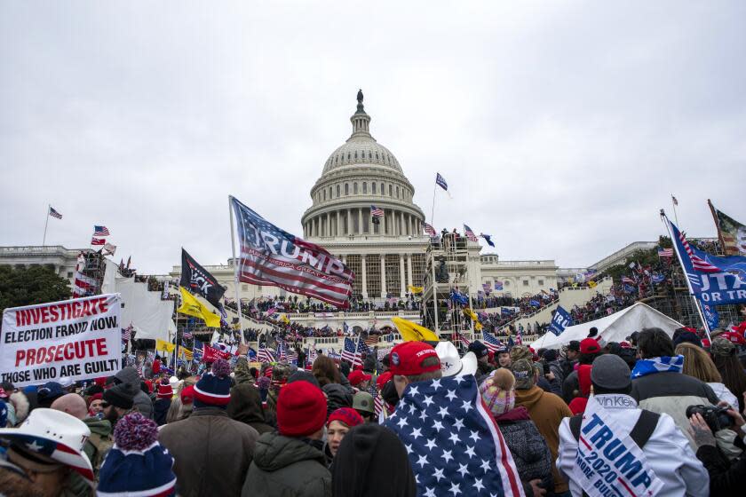 FILE - Rioters loyal to President Donald Trump rally at the U.S. Capitol in Washington on Jan. 6, 2021. Ronald Colton McAbee, who was employed as a Tennessee sheriff's deputy when he assaulted police officers protecting the U.S. Capitol from a mob of Donald Trump supporters, Jan. 6. 2021, was sentenced on Thursday to nearly six years in prison. (AP Photo/Jose Luis Magana, File)