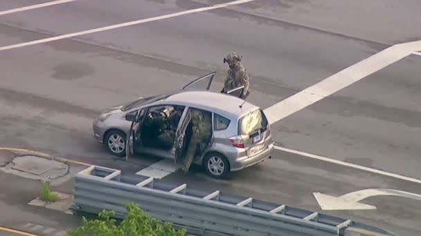 PHOTO: Law enforcement examine a vehicle in connection with the pursuit of Bobby Crimo, the person of interest in the shootings at the parade in Highland Park, Ill., July 4, 2022. (WLS)