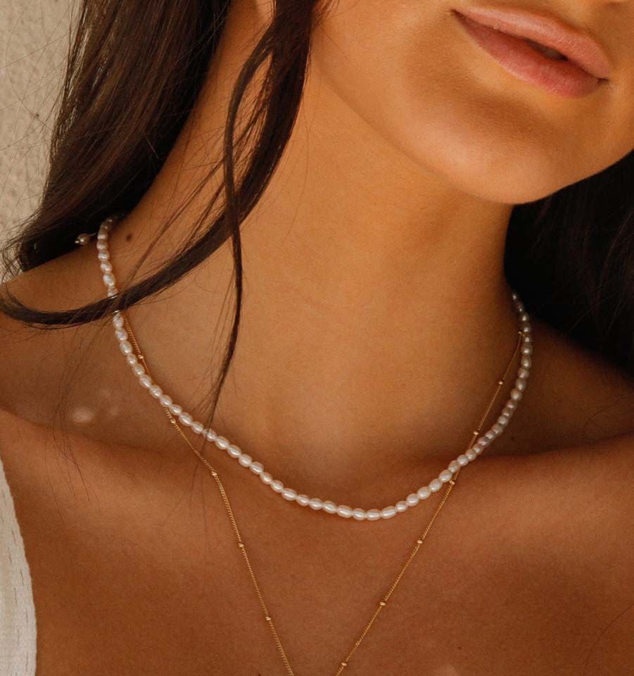 <p><a href="https://go.redirectingat.com?id=74968X1596630&url=https%3A%2F%2Frellery.com%2Fproducts%2Fpearl-necklace&sref=https%3A%2F%2F" rel="nofollow noopener" target="_blank" data-ylk="slk:Shop Now;elm:context_link;itc:0;sec:content-canvas" class="link ">Shop Now</a></p><p>14k Gold Plated Freshwater Pearl Necklace</p><p>rellery.com</p><p>$128.00</p>