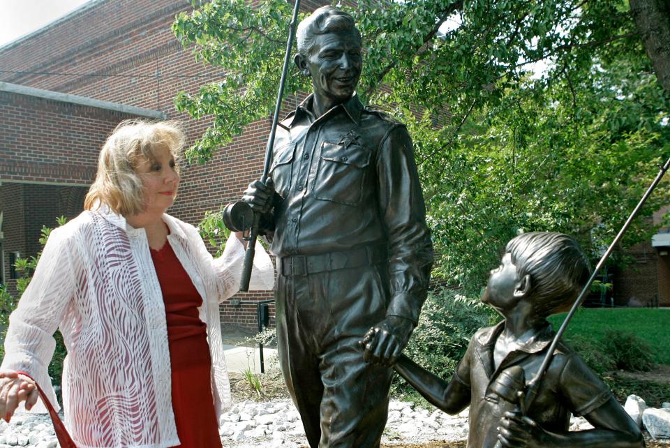 In a  Sept. 6, 2007 file photo, Betty Lynn, who played Thelma Lou on "The Andy Griffith Show," pauses at a statue of Andy and Opie Taylor in Mount Airy, N.C.