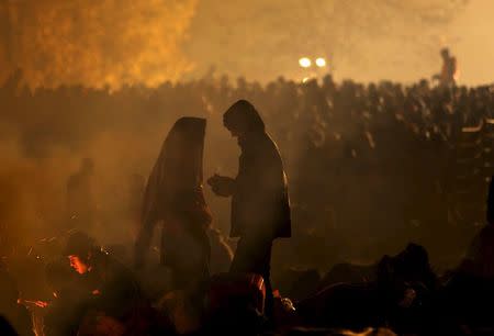 Migrants wait to cross the Slovenia-Austria border in Sentilj, Slovenia, October 27, 2015. REUTERS/Srdjan Zivulovic