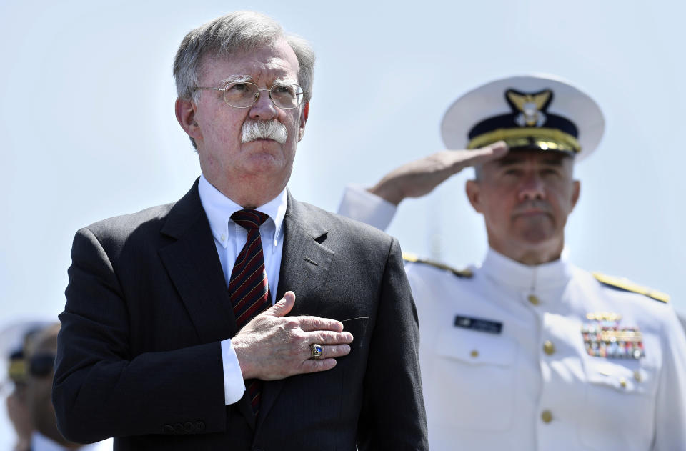 National Security Adviser John Bolton stands for the national anthem at the commencement for the United States Coast Guard Academy in New London, Conn., Wednesday, May 22, 2019. (AP Photo/Jessica Hill)