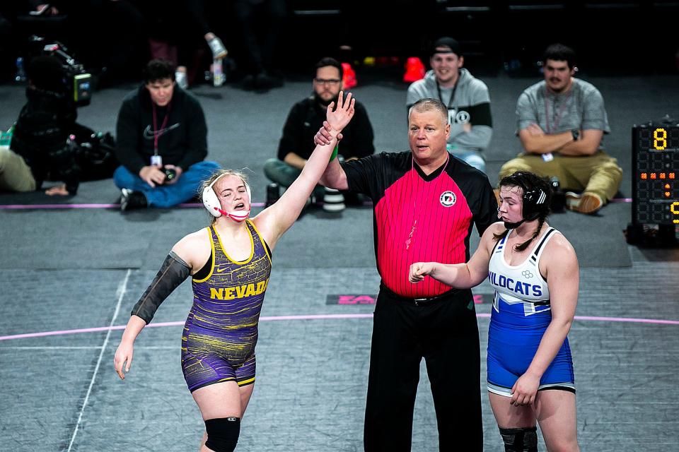 Nevada's Mackenzie Arends, left, has her hand raised after winning in overtime against West Lyon's Jana TerWee at 190 pounds in the finals during the IGHSAU state girls wrestling tournament, Friday, Feb. 3, 2023, at the Xtream Arena in Coralville, Iowa.