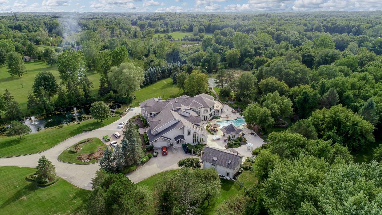 This Rochester Hills mansion, formerly owned by Detroit rapper Eminem, is back on the market.