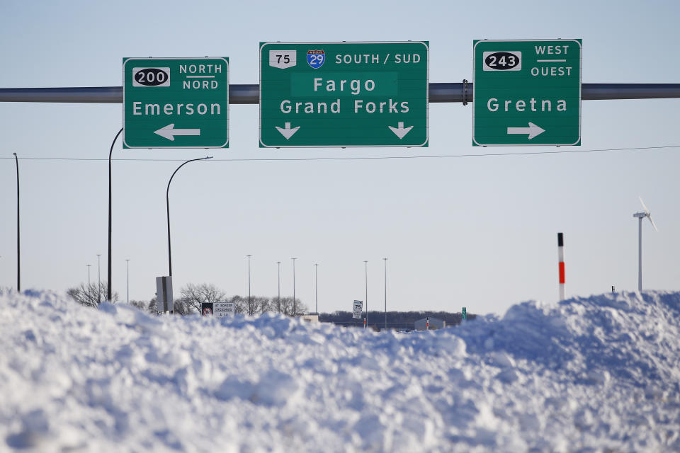 Road signage is posted just outside of Emerson, Manitoba on Thursday, Jan. 20, 2022. A Florida man charged with human smuggling related to the deaths last year of four immigrants near the Canadian border has pleaded not guilty to the federal charges, Friday, May 27, 2023. The bodies were found in the province of Manitoba just meters (yards) from the U.S. border near the community of Emerson. (John Woods/The Canadian Press via AP)