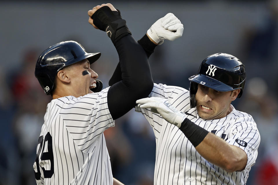 Joey Gallo (right) of the New York Yankees celebrates with Aaron Judge  after hitting a two-run home run against the Angels on Monday. (Photo by Adam Hunger/Getty Images)