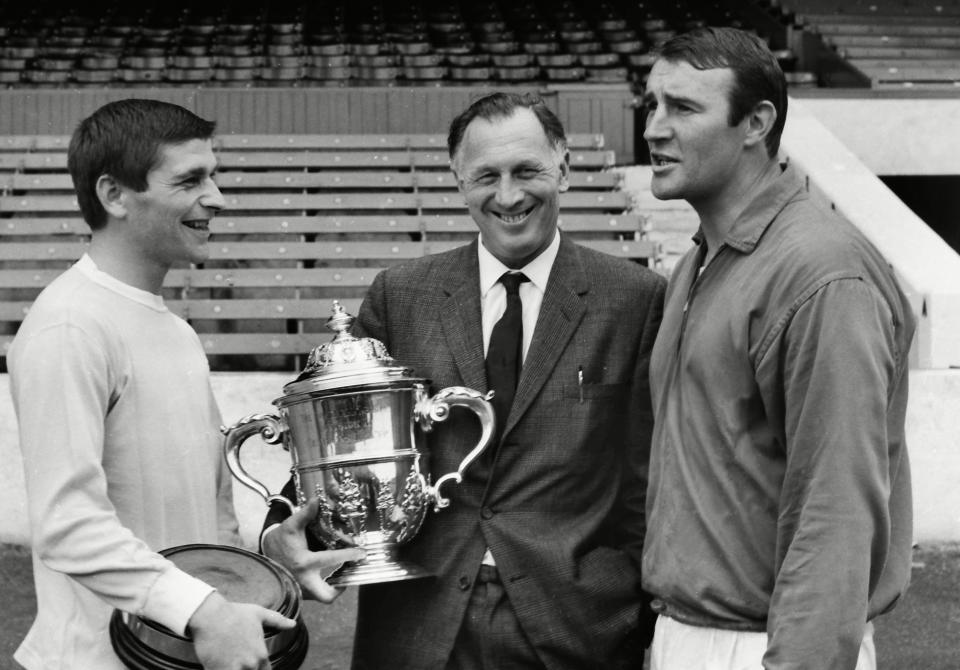 Manchester City’s Malcolm Allison and Joe Mercer pose with the division two trophy in 1966. (Rex)