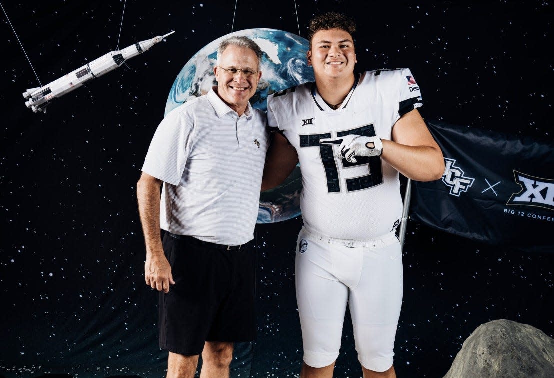 Benjamin offensive tackle Chase Malamala poses with UCF head coach Gus Malzahn during his official visit last month.
