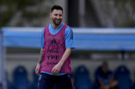 Argentina's Lionel Messi smiles during a team training session at the Argentina Soccer Association facilities ahead of a friendly soccer match against Panama, in Buenos Aires, Argentina, Wednesday, March 22, 2023. (AP Photo/Natacha Pisarenko)