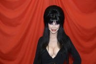 Cassandra Peterson as <a href="https://www.wwe.com/videos/elvira-joins-jesse-ventura-lord-alfred-hayes-on-commentary-at-wrestlemania-2" rel="nofollow noopener" target="_blank" data-ylk="slk:Elvira was a guest commentator;elm:context_link;itc:0;sec:content-canvas" class="link ">Elvira was a guest commentator</a> at Wrestlemania 2 in 1986.
