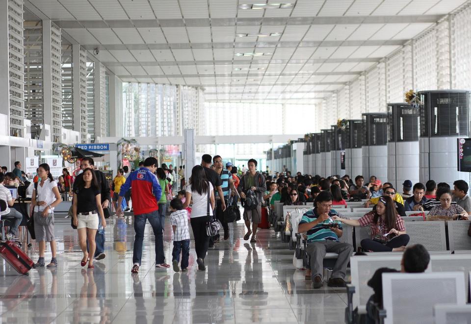 Passengers wait in Terminal 2 of Ninoy Aquino International Airport (NAIA). (Photo: Getty Images)