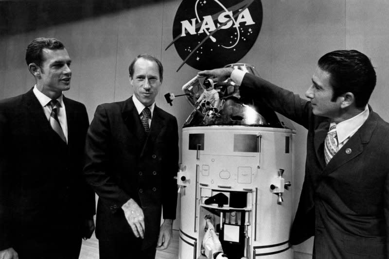 Apollo 15 astronauts David R. Scott (L) and Alfred M. Worden (C) watch James B. Irwin open the hatch on a model of the Apollo 15 command service module after a news conference at the Manned Spacecraft Center. On July 29, 1958, NASA was created. UPI File Photo