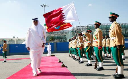 FILE PHOTO: Qatari Emir Sheikh Tamim bin Hamad al-Thani inspects a guard of honor upon arriving at the Bole International Airport during his official visit to Ethiopia's capital Addis Ababa, April 10, 2017. REUTERS/Tiksa Negeri/File Photo