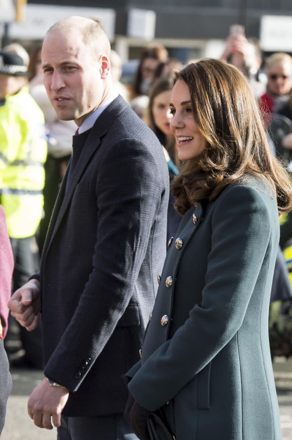 Kate showed off her bump in a fitted green coat. Photo: Getty