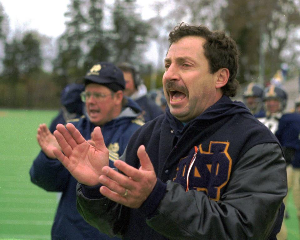 Mike D'Aloisio encourages his 1998 Elmira Notre Dame football team, which ended up advancing to the Class C state final before losing to Edgemont in overtime.