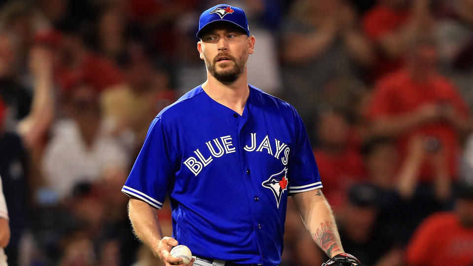 John Axford was traded to Milwaukee for cash considerations that ended up being literally one dollar. (Photo by Sean M. Haffey/Getty Images)