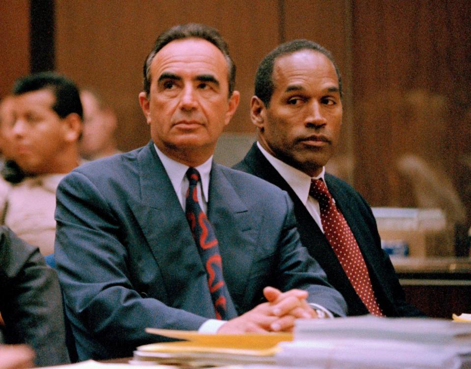 PHOTO: O. J. Simpson (R) appears with his attorney Robert Shapiro in Los Angeles County Superior Court for his preliminary hearing in Los Angeles, June 30, 1994. (Newsbase/AP, FILE)