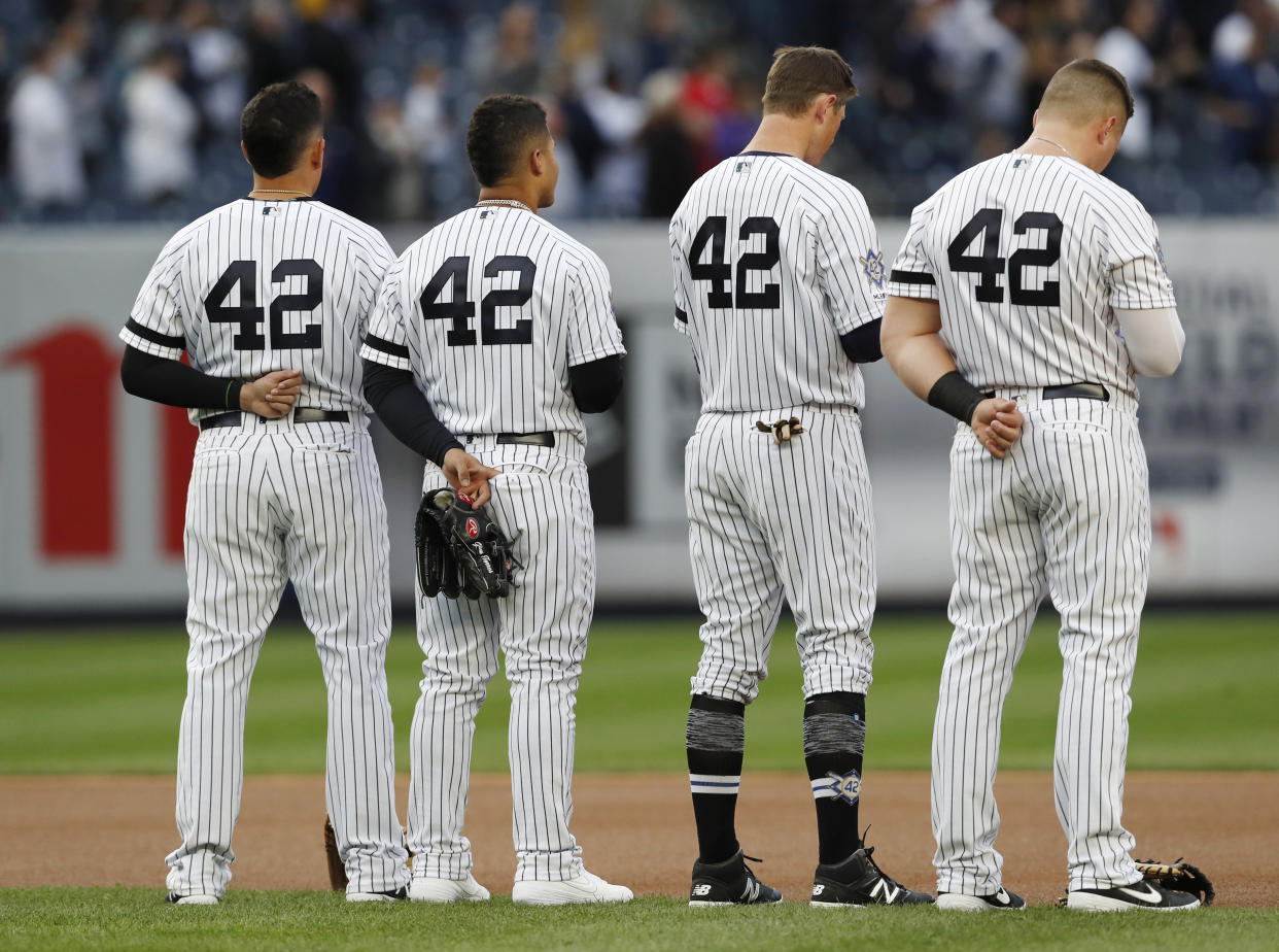 Yankees players wearing No. 42.