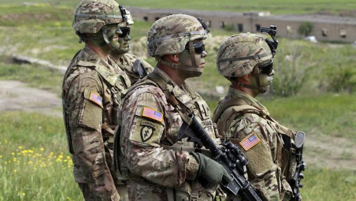 U.S. servicemen march to firing positions during joint military exercises at the Vaziani military base outside Tbilisi, Georgia, in 2016. President Joe Biden authorized the deployment of 3,000 reserve forces to Europe on Thursday.