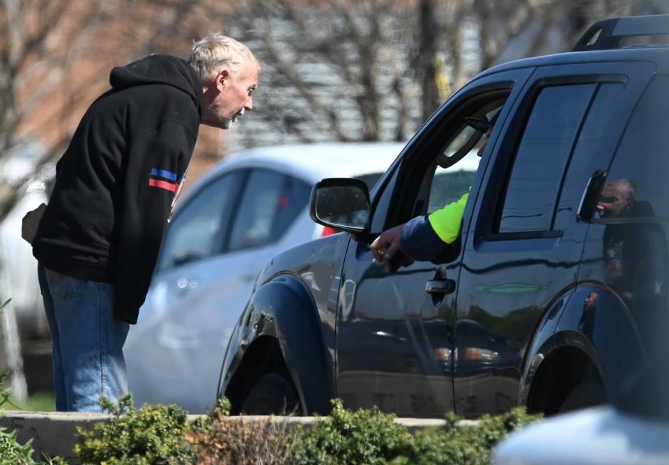 Lefty chats up a motorist from the median on South Boulevard.