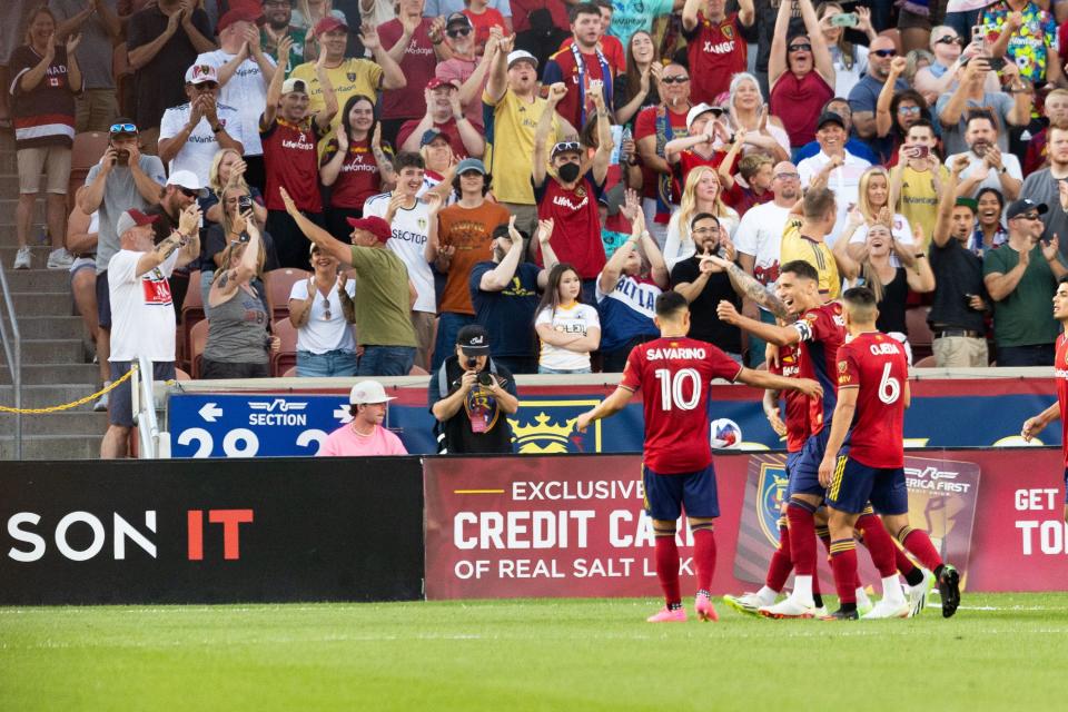 Real Salt Lake team members celebrate after <span class="caas-xray-inline-tooltip"><span class="caas-xray-inline caas-xray-entity caas-xray-pill rapid-nonanchor-lt" data-entity-id="Justen_Glad" data-ylk="cid:Justen_Glad;pos:6;elmt:wiki;sec:pill-inline-entity;elm:pill-inline-text;itc:1;cat:Athlete;" tabindex="0" aria-haspopup="dialog"><a href="https://search.yahoo.com/search?p=Justen%20Glad" data-i13n="cid:Justen_Glad;pos:6;elmt:wiki;sec:pill-inline-entity;elm:pill-inline-text;itc:1;cat:Athlete;" tabindex="-1" data-ylk="slk:Justen Glad;cid:Justen_Glad;pos:6;elmt:wiki;sec:pill-inline-entity;elm:pill-inline-text;itc:1;cat:Athlete;" class="link ">Justen Glad</a></span></span>’s goal for Real Salt Lake at America First Field in Sandy on Saturday, July 8, 2023. | Megan Nielsen, Deseret News