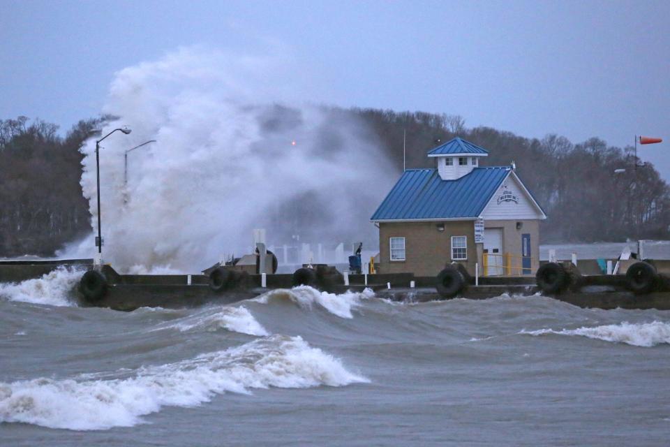 Waves crash at the Miller Boat Line docks on Catawba Island on Monday evening. Gale force winds out of the northwest brought 4-7 foot waves along the Lake Erie shoreline in Ottawa County and at the islands.