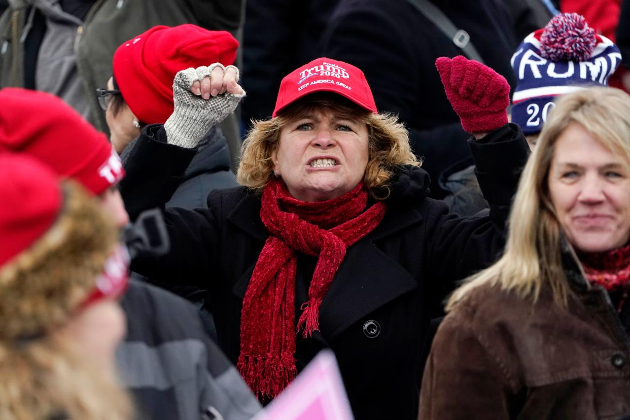A woman yells "CNN Sucks" towards members of the media on Wednesday, Jan. 6, 2021, in Washington, at a rally in support of President Donald Trump called the "Save America Rally."