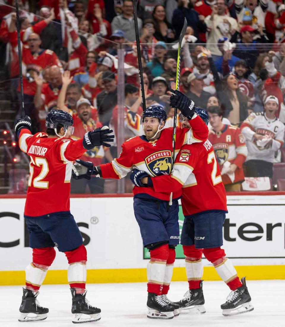 Florida Panthers center Sam Bennett (9) celebrates with his teammates after scoring a goal against the Tampa Bay Lightning in the first period in Game 2 of the first-round of the 2024 Stanley Cup Playoffs at Amerant Bank Arena on Tuesday, April 23, 2024, in Sunrise, Fla.