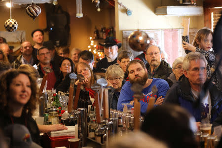 Voters listen as U.S. Senator Cory Booker (D-NJ) speaks during his 2020 U.S. presidential campaign at the Iowa River Brewing in Marshalltown, Iowa, U.S., February 9, 2019. REUTERS/Scott Morgan