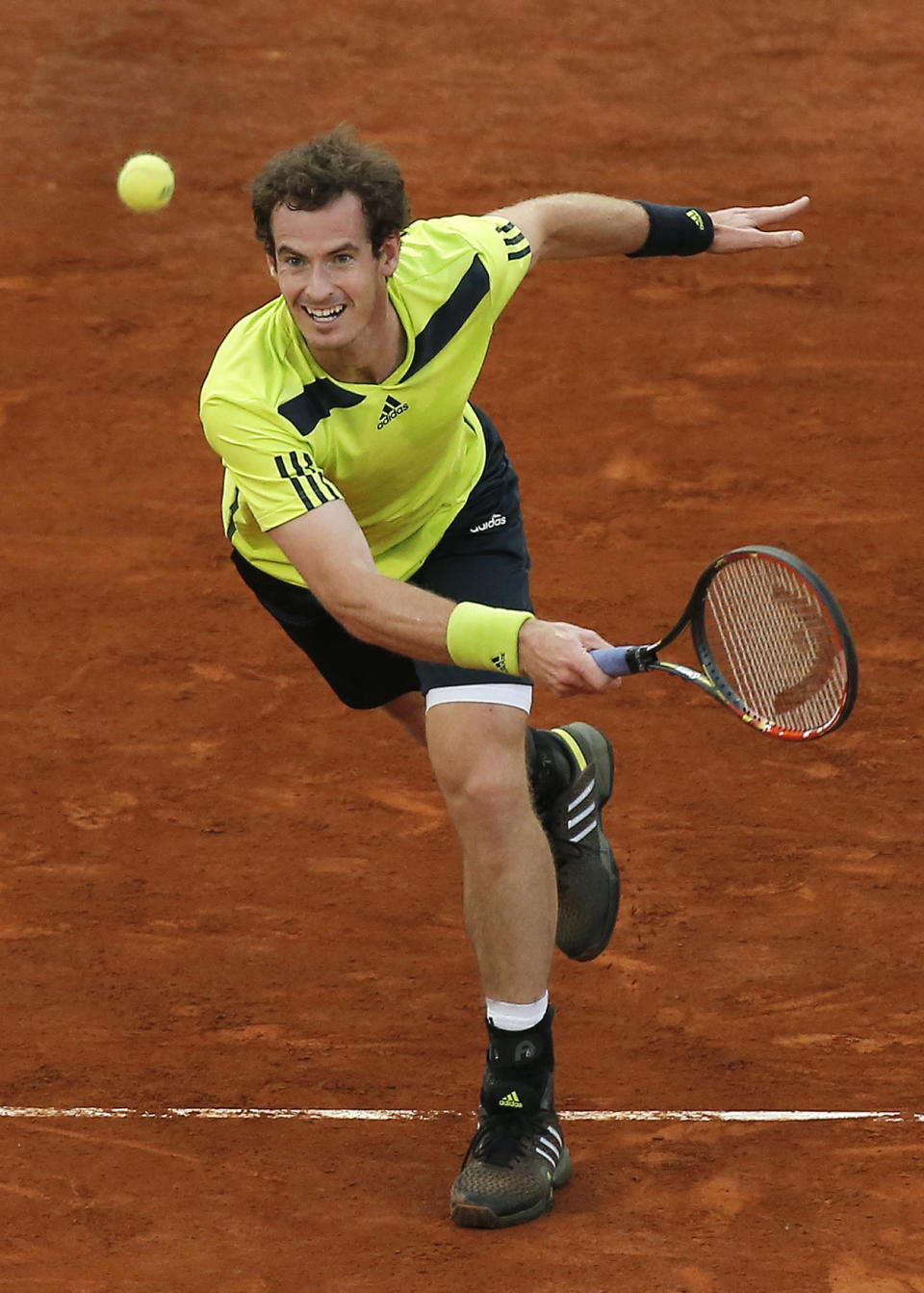 Andy Murray returns the ball during a Madrid Open tennis tournament match against Nicolas Almagro from Spain, in Madrid, Spain, Wednesday, May 7, 2014. (AP Photo/Andres Kudacki)