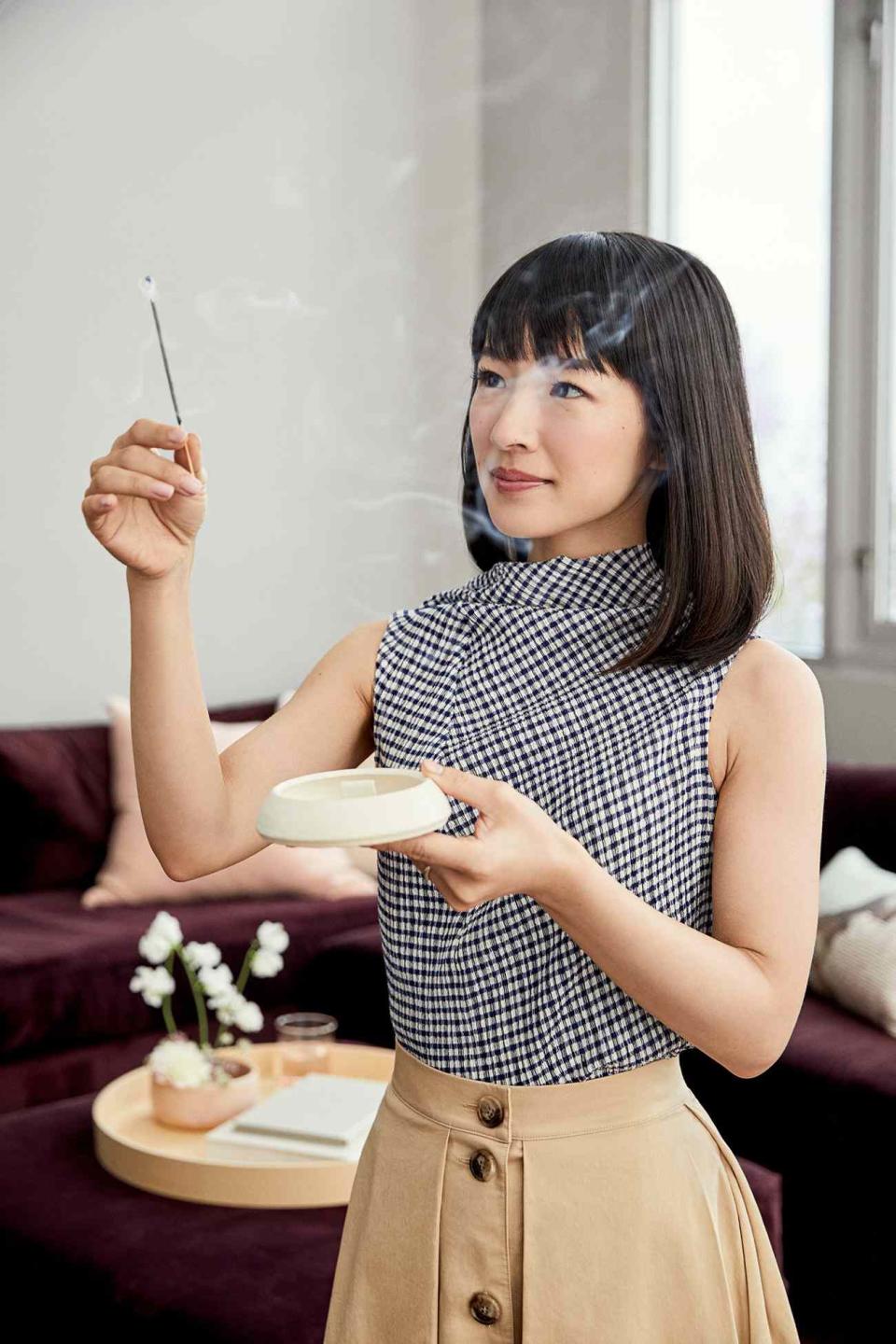 marie kondo working with incense stick