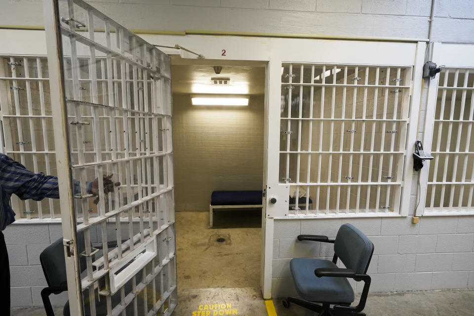 FILE - A bed is seen through the bars in one of the holding cells near the death chamber at Greensville Correctional Center in Jarratt, Va., March 24, 2021. The Virginia Department of Corrections has recorded audio of at least 30 executions over the last three decades, but it has no plans to release the tapes publicly. The department rejected an Associated Press request under the state's public records law to release the recordings after NPR obtained and reported on four of them. They offer a rare glimpse into executions. (AP Photo/Steve Helber, File)