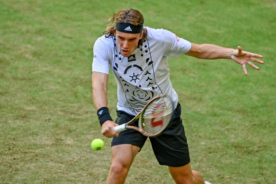 Seen here, Stefanos Tsitsipas playing a backhand against Benjamin Bonzi at the Halle Open.