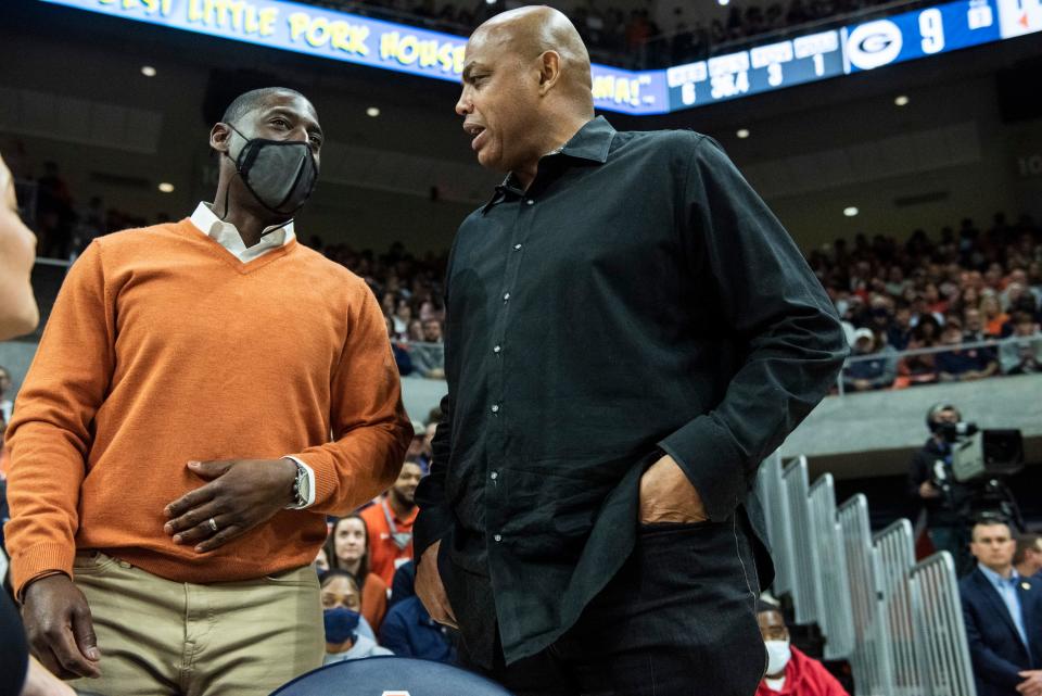 Auburn Athletic Director Allen Greene talks with former Auburn player Charles Barkley as Auburn Tigers take on Georgia Bulldogs at Auburn Arena in Auburn, Ala., on Wednesday, Jan. 19, 2022.