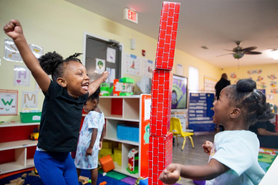 Zariah, 3, and Kirsten, 3, cheer for the tower of blocks they made during the Equity to Prosperity preschool program in Memphis, Tenn., on Thursday, September 7, 2023.