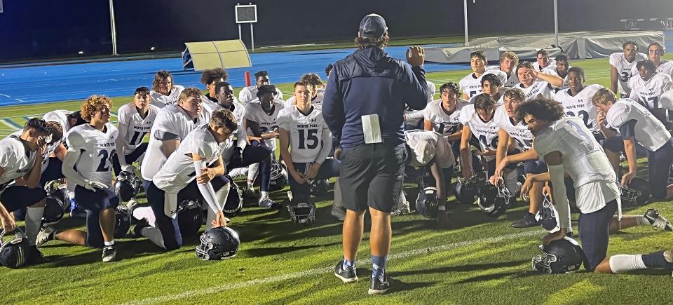 North Port High football coach Garon Belser speaks with his team after the Bobcats dropped a 28-10 decision to IMG Academy Blue on Sept. 8, 2022, at IMG Academy field in Bradenton.