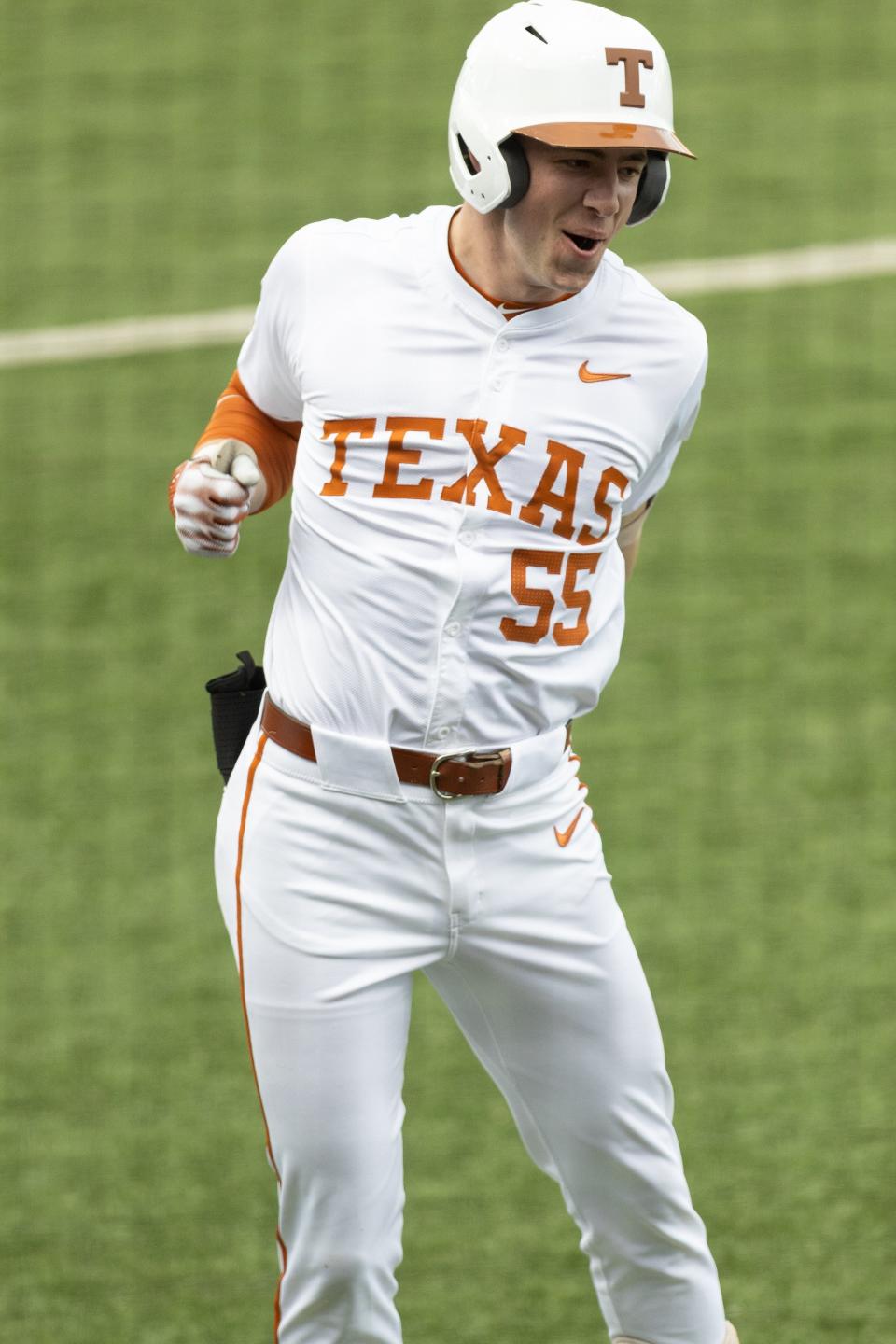 Texas outfielder Casey Cummings celebrates after hitting a home run during the annual Texas Alumni baseball game on Saturday. The Texas team beat the alumni 7-4. The Longhorns open their season on Feb. 16.