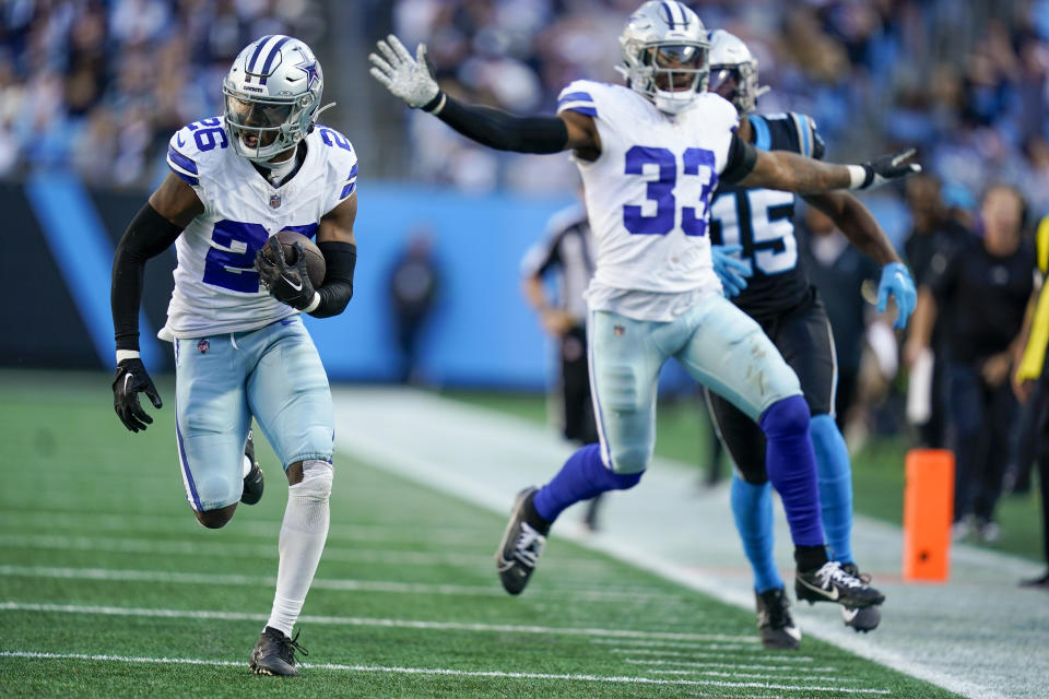 Dallas Cowboys cornerback DaRon Bland runs for a touchdown after intercepting the pass against the Carolina Panthers during the second half of an NFL football game Sunday, Nov. 19, 2023, in Charlotte, N.C. (AP Photo/Erik Verduzco)