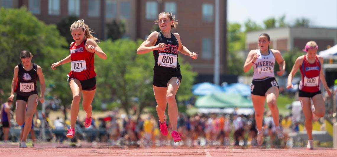 Hesston’s Ashley Lehman earsily wins the 3A 100 meter dash during the state track and field championships at Cessna Stadium on Saturday. 