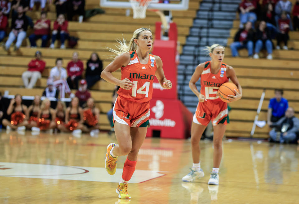 BLOOMINGTON, UNITED STATES - 2023/03/18: Miami Hurricanes guard Hanna Cavinder (15) and Miami Hurricanes guard Haley Cavinder (14) play against Oklahoma State during an NCAA womens basketball tournament game at Simon Skjodt Assembly Hall. Miami beat Oklahoma State 62-61. (Photo by Jeremy Hogan/SOPA Images/LightRocket via Getty Images)