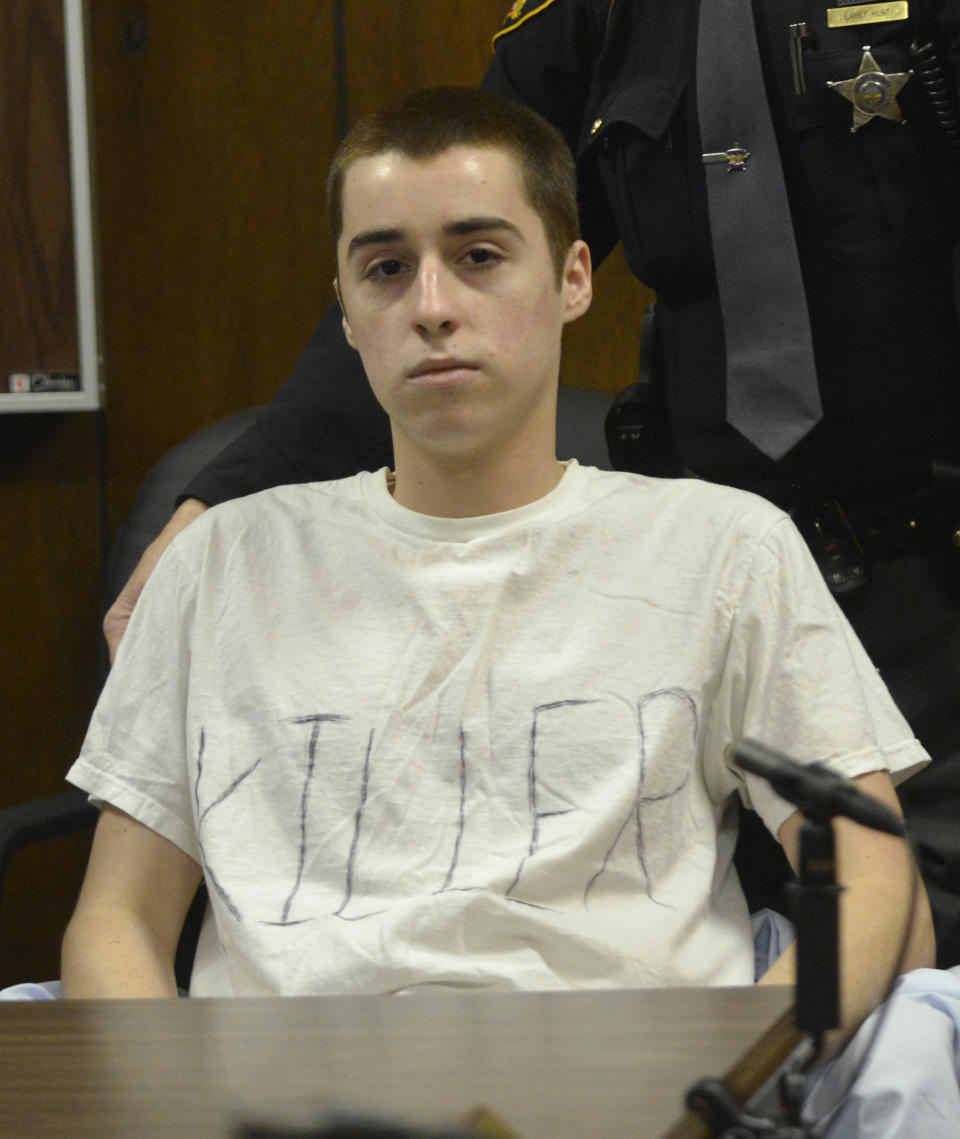 T.J. Lane sits in court during sentencing Tuesday, March 19, 2013, in Chardon, Ohio. Lane, was given three lifetime prison sentences without the possibility of parole Tuesday for opening fire last year in a high school cafeteria in a rampage that left three students dead and three others wounded. Lane, 18, had pleaded guilty last month to shooting at students in February 2012 at Chardon High School, east of Cleveland. Investigators have said he admitted to the shooting but said he didn't know why he did it. Before the case went to adult court last year, a juvenile court judge ruled that Lane was mentally competent to stand trial despite evidence he suffers from hallucinations, psychosis and fantasies. (AP Photo/The News-Herald, Duncan Scott, Pool)