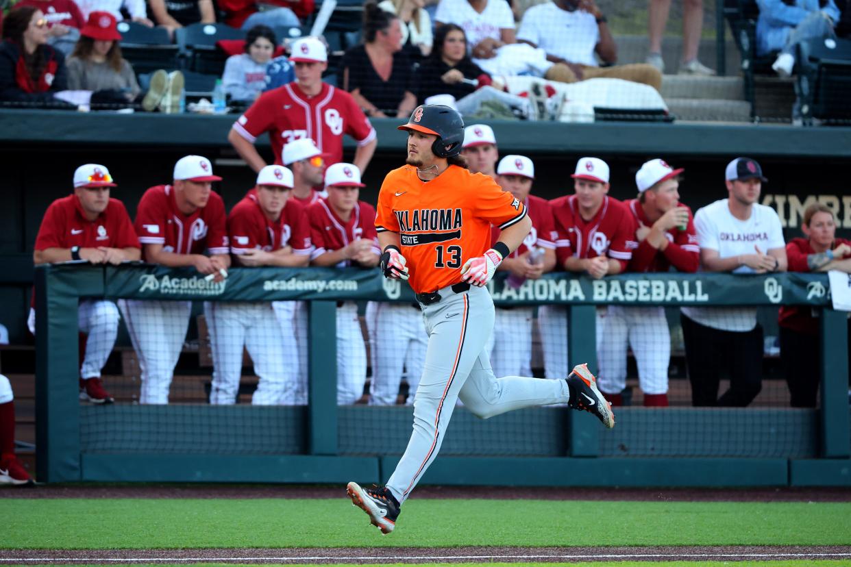 Oklahoma State's Kollin Ritchie runs to home plate on a home run during a game on March 12 against OU in Norman.